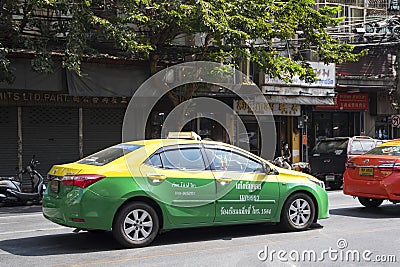 City taxi travels on the road in Bangkok Editorial Stock Photo