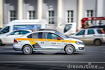 City taxi Yandex speeding along the main street of the city. Motion blur. Moscow, Russia - April 5, 2019 Editorial Stock Photo