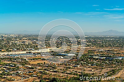 The city of Tuscon with houses and homes on the outskirts of downtown with open pastures and yards near residences Stock Photo