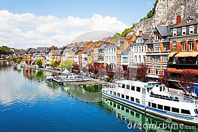City view of Dinant on Meuse river with ships Stock Photo