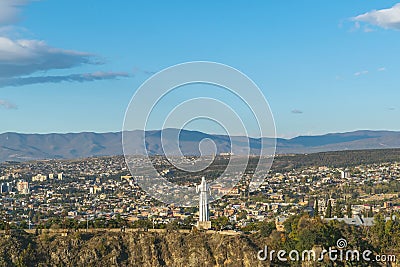 City view. View of Kartlis Deda. Tbilisi, Georgia. A city among the mountains Stock Photo
