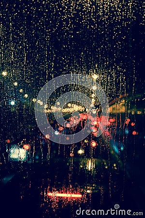 City view through a window on a rainy night Stock Photo