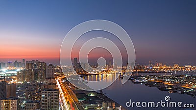 Cityscape of Ajman from rooftop day to night timelapse. Ajman is the capital of the emirate of Ajman in the United Arab Emirates. Stock Photo