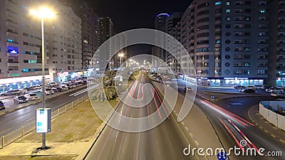 Cityscape of Ajman from bridge at night timelapse. Ajman is the capital of the emirate of Ajman in the United Arab Emirates. Stock Photo