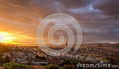 The cityscape of beautiful Florence, Italy, as the cloudy sky erupts with color as the sun sets Editorial Stock Photo
