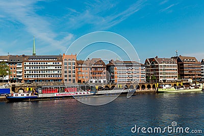 Cityscape of Bremen with old architecture, historical wooden sailing ships and barge floating along the river Weser Editorial Stock Photo