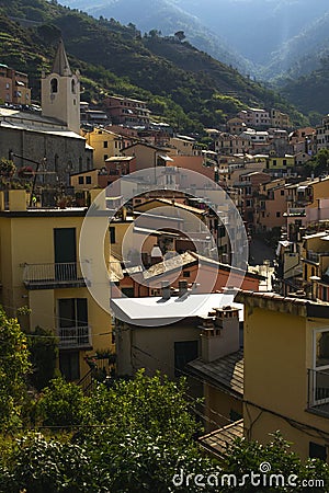 Cityscape of Cinque Terre village roofs with traditional houses coast with hazy sky Stock Photo