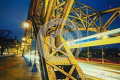 Cityscape - evening view on bridge with lights moving vehicles Stock Photo