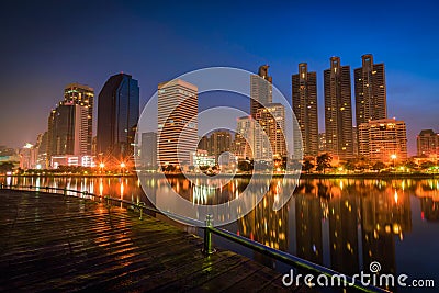 Cityscape image of Benchakitti Park at night in Bangkok Stock Photo