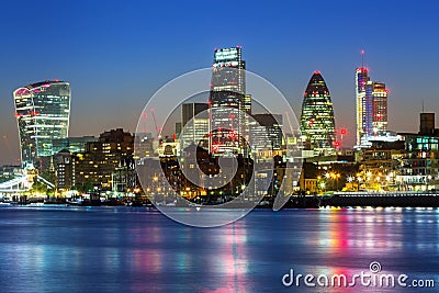 Cityscape of London with reflection in Thames river Stock Photo