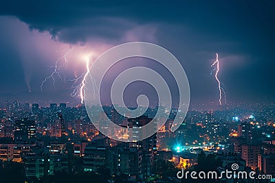 Cityscape at night with two lightning strikes creating dramatic scenery Stock Photo