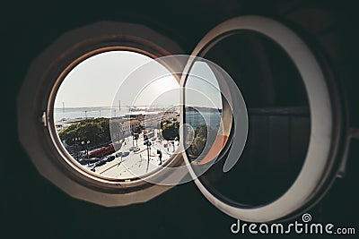 A cityscape through the round window Editorial Stock Photo