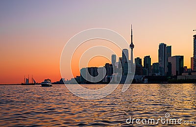 Cityscape - silhouettes of skyscrapers, calm lake old sail ship and yacht. Stock Photo