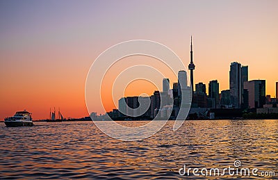Cityscape - silhouettes of skyscrapers, calm lake old sail ship and yacht. Stock Photo