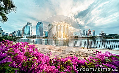Cityscape of the skyscraper business district at Benchakitti park in the morning at Bangkok, Thailand. View Bangkok city with park Stock Photo