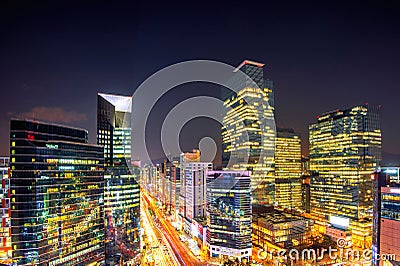 Cityscape of South Korea. Night traffic speeds through an intersection in the Gangnam district of Seoul, Korea. Stock Photo