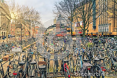 Cityscape on a sunny winter day - view of the bike parking in the historic center of Amsterdam Editorial Stock Photo