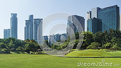 Cityscape and trees grassland garden park at the business town Stock Photo