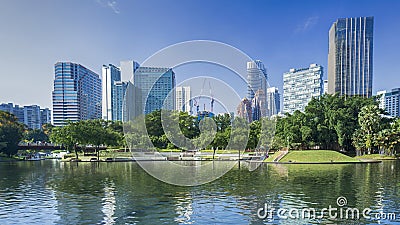 Cityscape and trees grassland garden with water pool Stock Photo