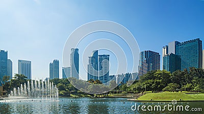 Cityscape and trees grassland garden with water pool Editorial Stock Photo