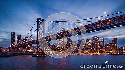 Cityscape view of San Francisco and the Bay Bridge at Night Editorial Stock Photo