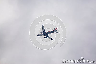 A civil airliner flies in the sky Stock Photo