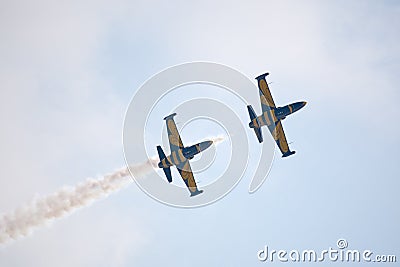 Civil airplanes making aerobatic manoeuvres Editorial Stock Photo