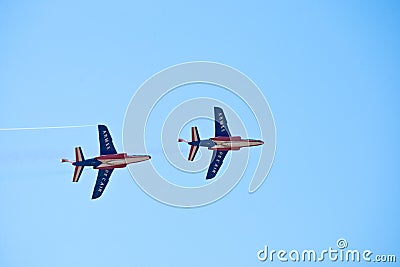 Civil airplanes making aerobatic manoeuvres Editorial Stock Photo