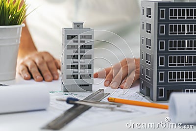 Civil engineering housing development - house scale models and blueprints on the desk Stock Photo