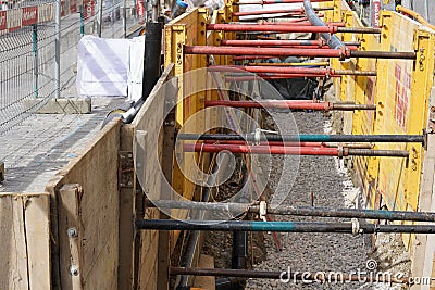 Civil engineering trench fully equipped with shoring for safety reasons. Editorial Stock Photo