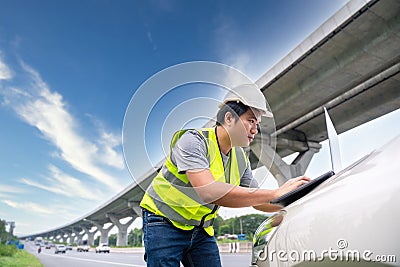 A Civil Engineers checking the expressway on road construction Stock Photo