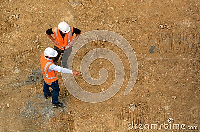 Civil engineers inspecting construction site Editorial Stock Photo