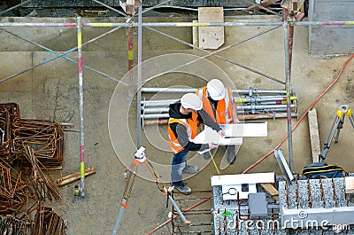 Civil engineers inspecting construction site Editorial Stock Photo