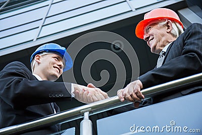 Civil engineers shaking hands Stock Photo