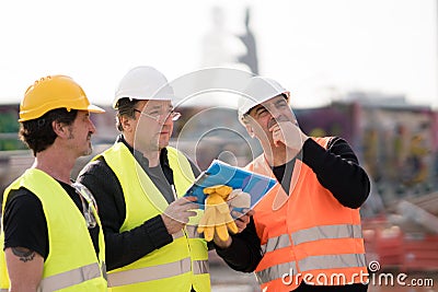 Civil engineers at work on construction site Stock Photo