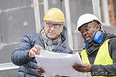 Civil engineers working on construction site Stock Photo