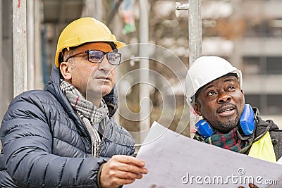 Civil engineers working on construction site Stock Photo