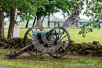 A Civil War era cannon is placed behind a stone wall in Gettysburg, PA - image Stock Photo