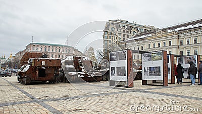 Civilian car shot by Russian soldiers. War in Ukraine. Destroyed russian tank on the Mykhailivs'ka Square. Editorial Stock Photo