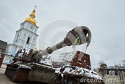 Civilian car shot by Russian soldiers. War in Ukraine. Destroyed russian tank on the Mykhailivs'ka Square. Editorial Stock Photo