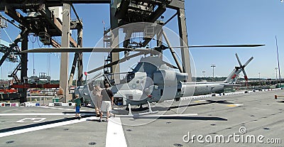 Civilians inspect an AH-1W Super Cobra helicopter Editorial Stock Photo