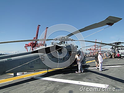 Civilians inspect an SH-60 Seahawk Editorial Stock Photo
