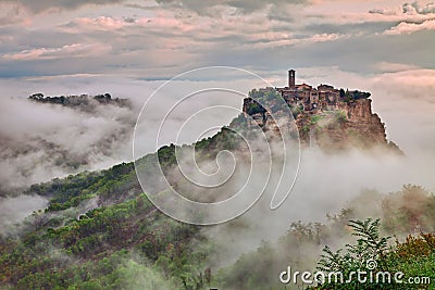 Civita di Bagnoregio, Viterbo, Lazio, Italy: landscape at dawn with fog Stock Photo