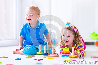Cjildren playing with wooden toys Stock Photo