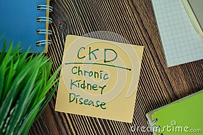 CKD - Chronic Kidney Disease write on sticky notes isolated on Wooden Table Stock Photo