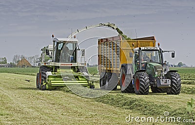 Claas chopper filling Veenhuis silage wagon Editorial Stock Photo