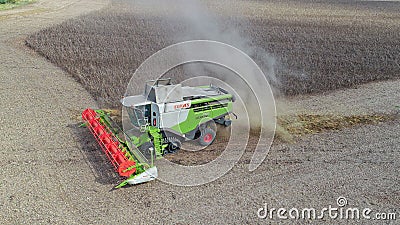 Claas combine harvester shown harvesting the late bean crop. Editorial Stock Photo