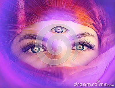 A clairvoyant girl with an open `third eye` on her forehead. The witch. The concept of clairvoyance. Piercing, magical eyes, looki Stock Photo