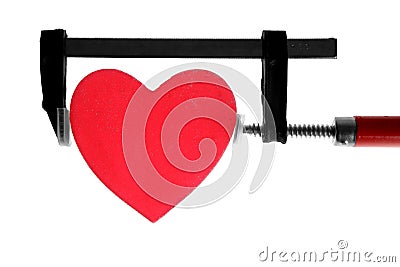 Clamp grip tool pressing red heart Stock Photo