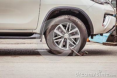 Clamped Wheel, Car Locked by Police for Prohibit Park. Stock Photo